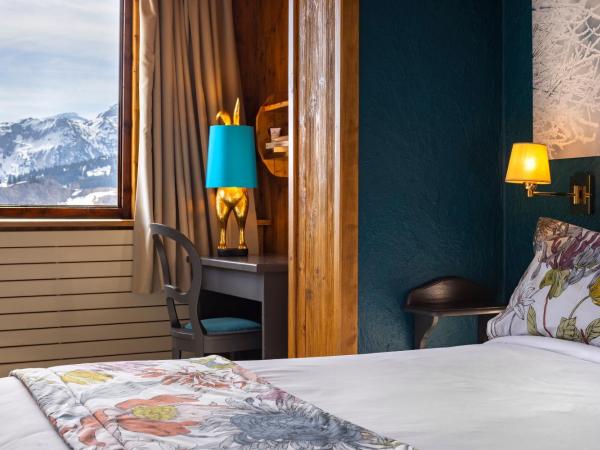 Hôtel Courcheneige : photo 1 de la chambre chambre familiale