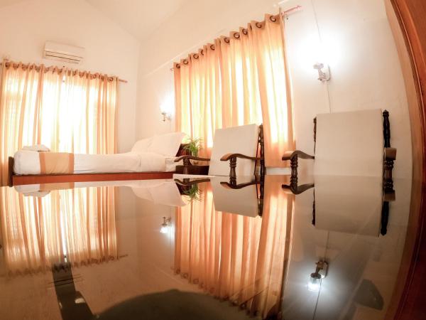 Happy Days Inn : photo 4 de la chambre chambre lit king-size supérieure