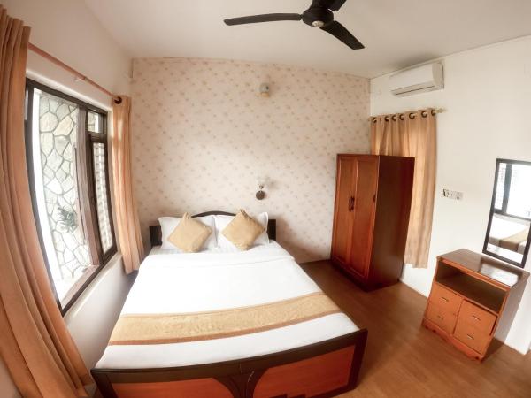 Happy Days Inn : photo 3 de la chambre chambre lit king-size deluxe