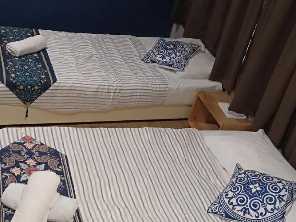 Wayton Express : photo 2 de la chambre chambre triple Économique avec salle de bains commune