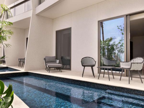 Hilton Cancun, an All-Inclusive Resort : photo 1 de la chambre suite lit king-size avec accès piscine - côté océan