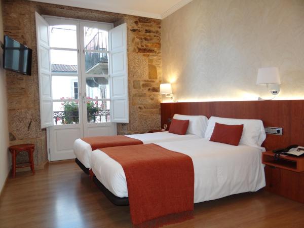 Pensión O Códice : photo 2 de la chambre chambre lits jumeaux supérieure