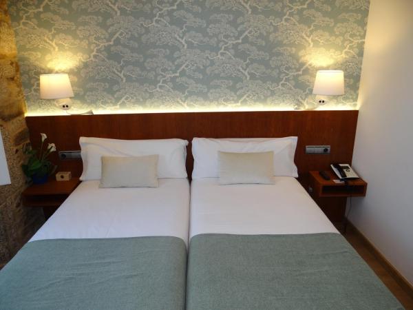 Pensión O Códice : photo 3 de la chambre chambre lits jumeaux supérieure