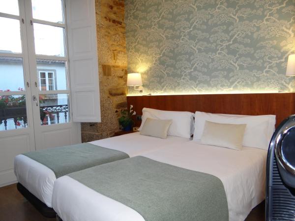 Pensión O Códice : photo 2 de la chambre chambre lits jumeaux supérieure