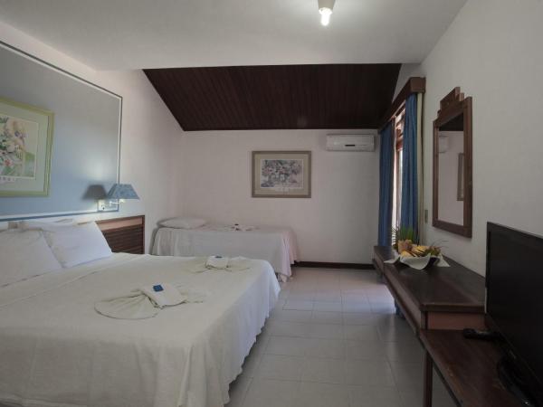 Colonna Galapagos Garden Hotel : photo 1 de la chambre chambre triple supérieure - vue sur mer