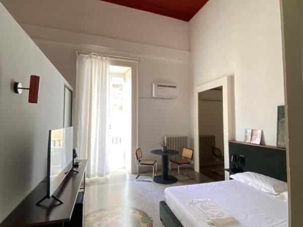 Roiss Haus Suites : photo 1 de la chambre suite lit king-size avec balcon