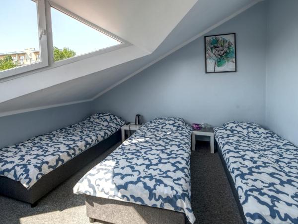 Noclegi pokoje gościnne Żeglarz : photo 1 de la chambre chambre quadruple