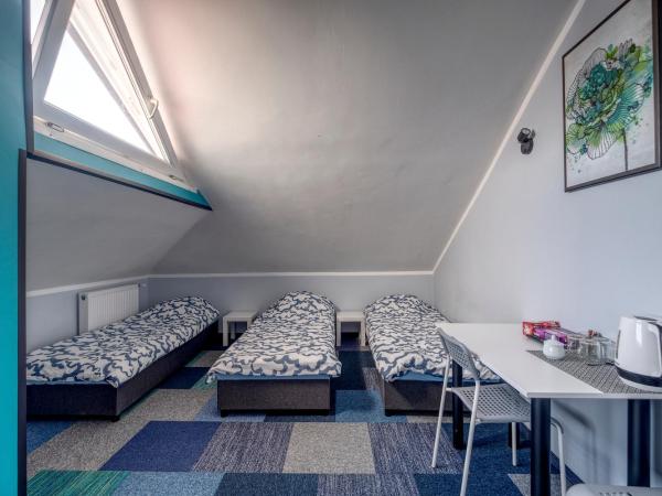 Noclegi pokoje gościnne Żeglarz : photo 4 de la chambre chambre quadruple