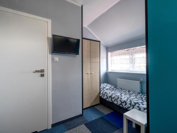 Noclegi pokoje gościnne Żeglarz : photo 5 de la chambre chambre quadruple