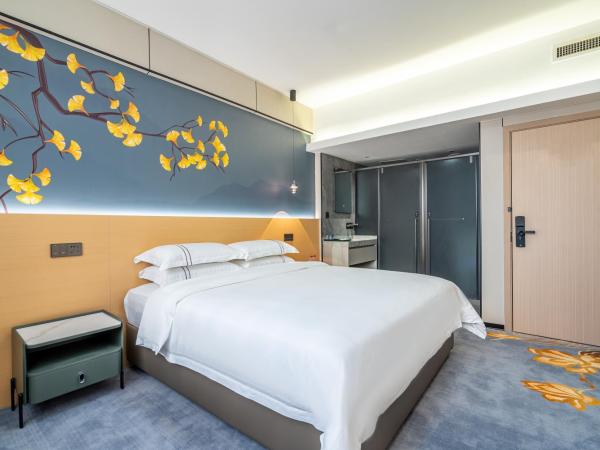 WAIFIDEN Hotel -Former Tokai Hotel - Xiaobei Metro Station - Free shuttle bus during Canton Fair : photo 3 de la chambre chambre supérieure lit queen-size