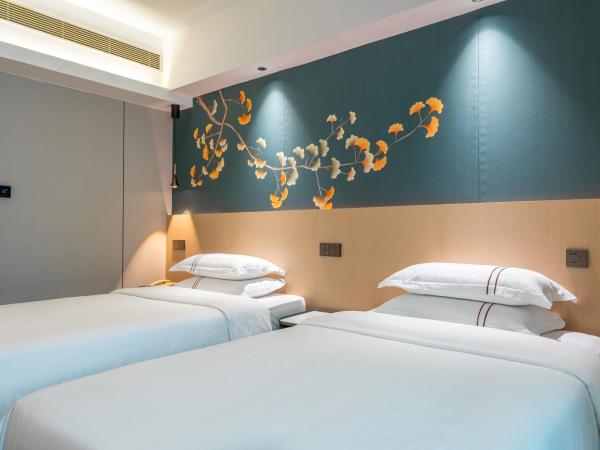 WAIFIDEN Hotel -Former Tokai Hotel - Xiaobei Metro Station - Free shuttle bus during Canton Fair : photo 2 de la chambre chambre lits jumeaux supérieure