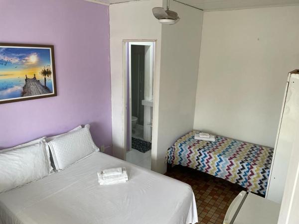 Nascimento Suites : photo 1 de la chambre chambre double + lit simple