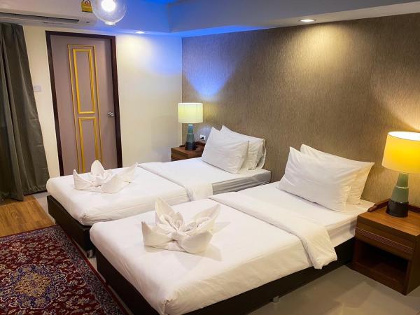 Kim Hotel At Morleng : photo 1 de la chambre chambre lits jumeaux pour personnes à mobilité réduite