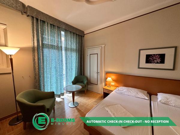 E-Rooms Minusio : photo 7 de la chambre chambre lits jumeaux - vue sur lac