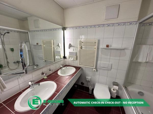 E-Rooms Minusio : photo 5 de la chambre chambre lits jumeaux - vue sur lac