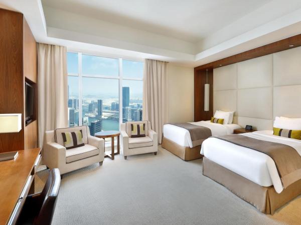 JW Marriott Marquis Hotel Dubai : photo 5 de la chambre chambre lits jumeaux exécutive avec accès au salon