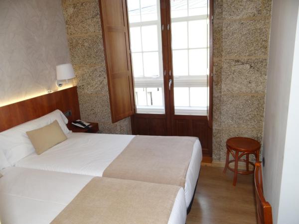 Pensión O Códice : photo 4 de la chambre chambre lits jumeaux