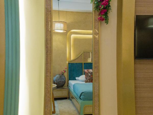Hotel Sarang Palace - Boutique Stays : photo 7 de la chambre bohemian theme room with artistic rattan décor and designer washroom