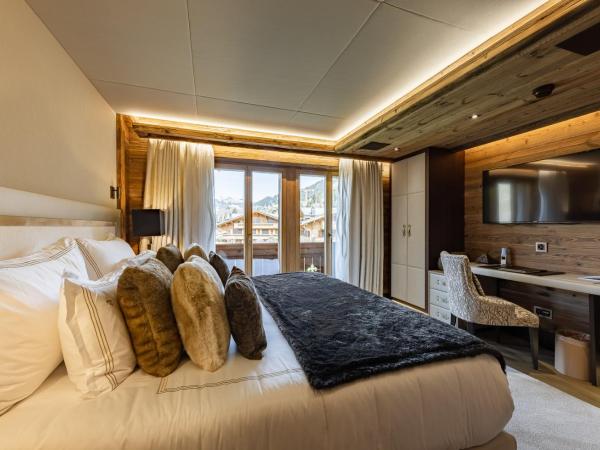 Ultima Gstaad Residences : photo 10 de la chambre appartement avec balcon