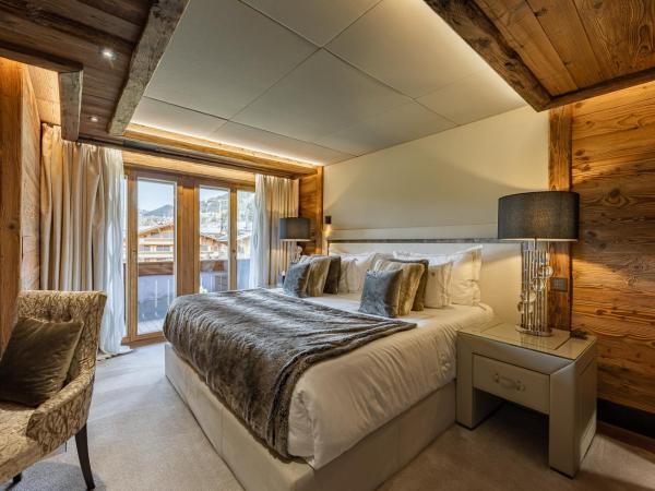 Ultima Gstaad Residences : photo 2 de la chambre appartement avec balcon