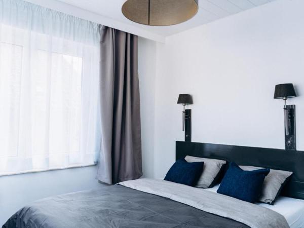 Atomihotel: Contemporary Comfort Steps from the Atomium! : photo 2 de la chambre chambre double deluxe avec douche