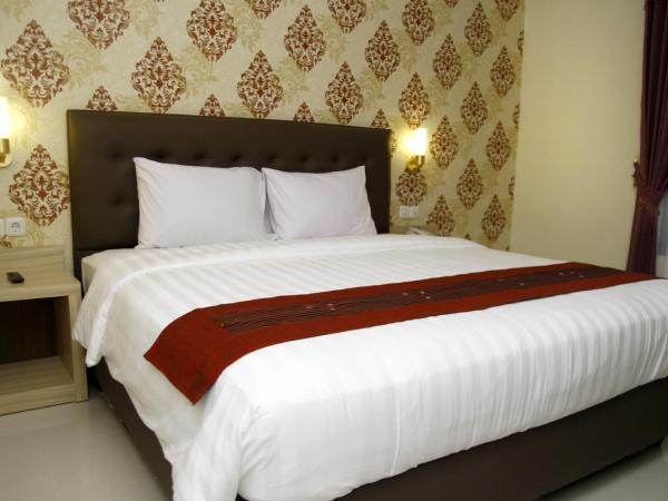 Hersya Front One Inn Surabaya : photo 3 de la chambre chambre lit king-size deluxe