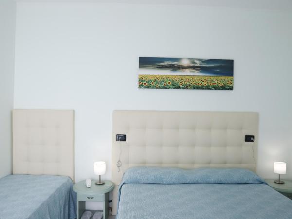 Hotel La Bussola : photo 1 de la chambre chambre familiale (2 adultes + 2 enfants de moins de 11 ans)