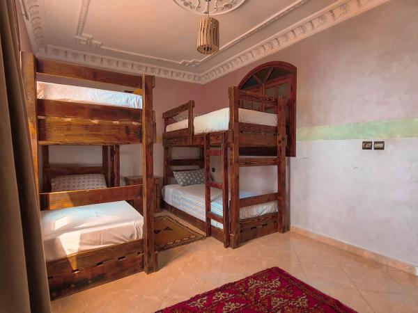 The Sunrise Villa : photo 5 de la chambre chambre quadruple - vue sur jardin