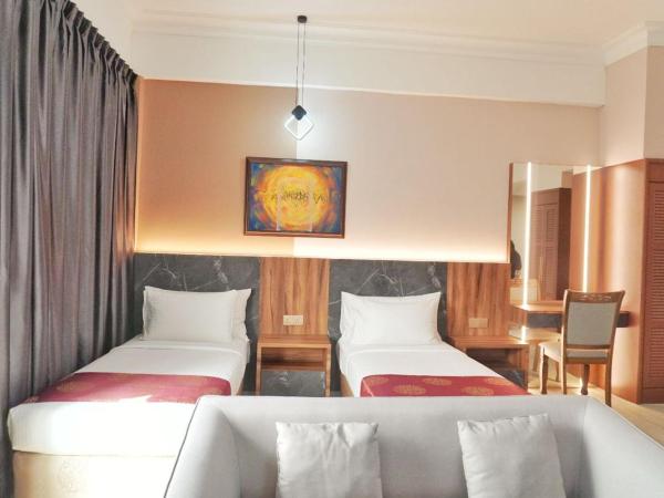 The Avenue M : photo 3 de la chambre suite exécutive