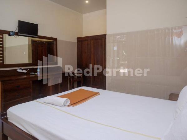 Wisma Garuda Syariah Condoongcatur Mitra RedDoorz : photo 9 de la chambre chambre double standard