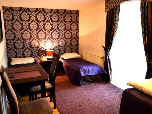 Hotel Pałac Akropol : photo 2 de la chambre chambre triple
