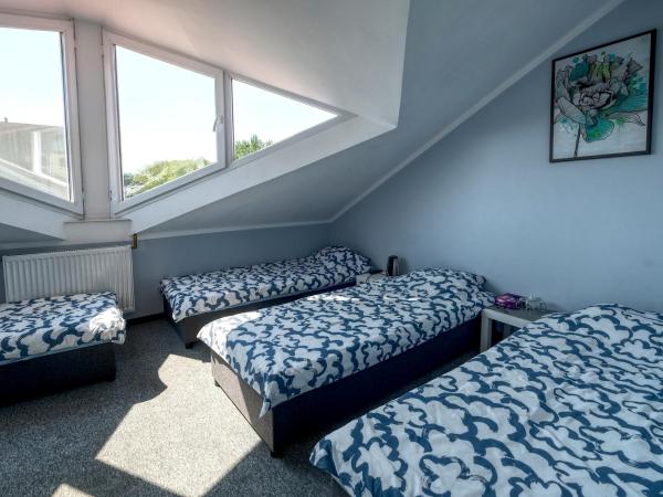 Noclegi pokoje gościnne Żeglarz : photo 3 de la chambre chambre quadruple