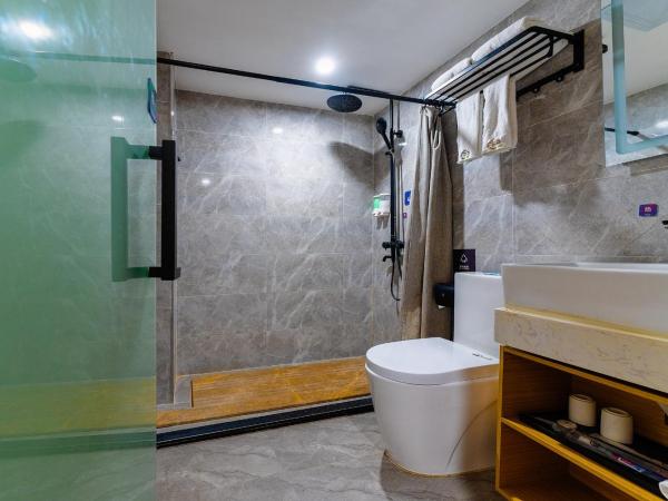 Amemouillage Inn - Guangzhou Railway Station Xicun Metro Station : photo 7 de la chambre chambre triple deluxe