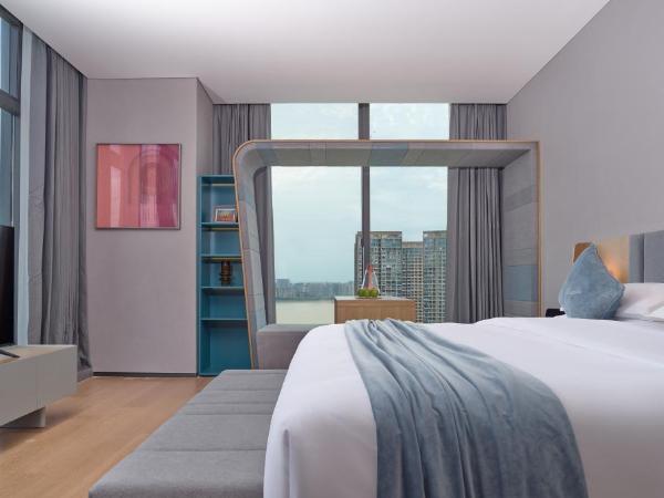 Pagoda Hotel Hangzhou Binjiang : photo 1 de la chambre chambre double exécutive - vue sur rivière