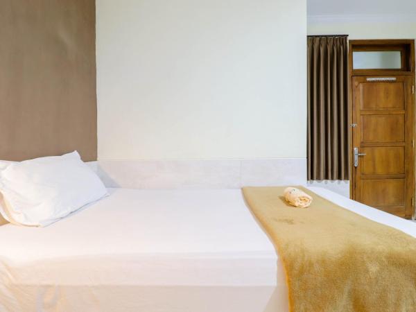 Hotel Safara Yogyakarta : photo 10 de la chambre chambre triple deluxe