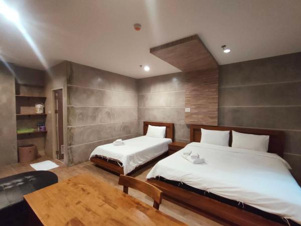 Komol Residence Bangkok : photo 2 de la chambre suite junior - vue sur jardin