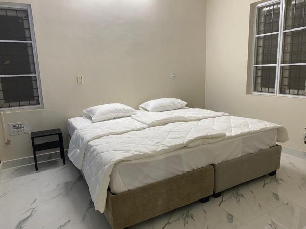 ELHANAN Transit Home : photo 1 de la chambre chambre double ou lits jumeaux deluxe – vue sur jardin