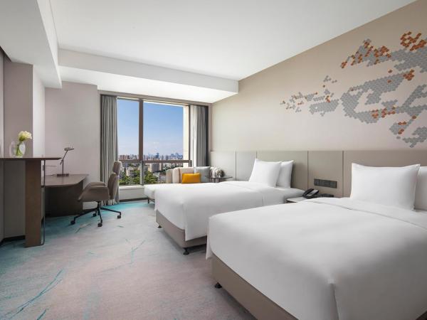 Crowne Plaza Shanghai Jinxiu, an IHG Hotel : photo 4 de la chambre chambre lits jumeaux standard avec vue sur jardin