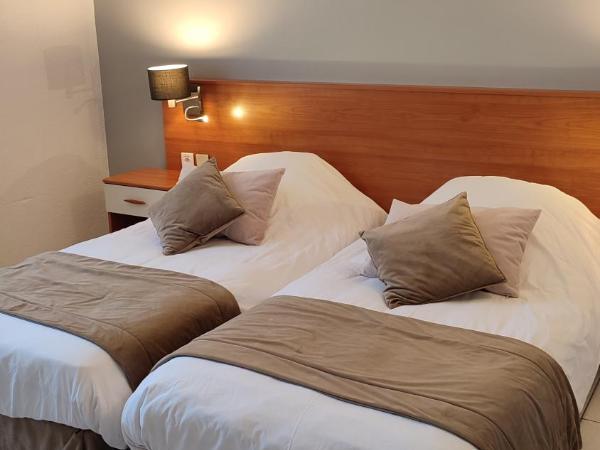 Hotel Restaurant Miramar L'orchidée : photo 4 de la chambre chambre lits jumeaux - vue sur cour