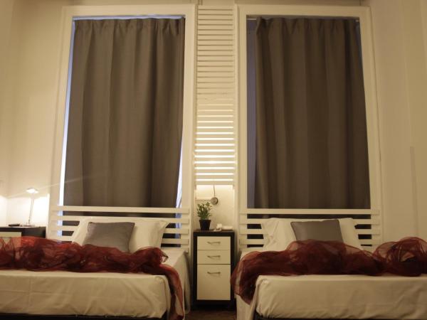 Hotel RossoVino Milano : photo 2 de la chambre chambre lits jumeaux avec salle de bains privative
