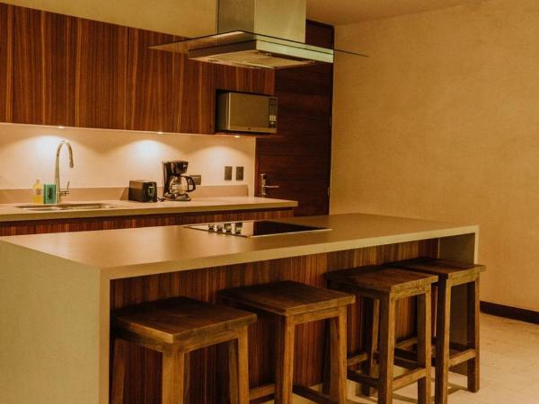 Copal Tulum Hotel : photo 8 de la chambre appartement de luxe jungle 2 chambres avec 1 lit king-size, 2 lits simples, 1 canapé-lit king-size et terrasse - vue sur jardin