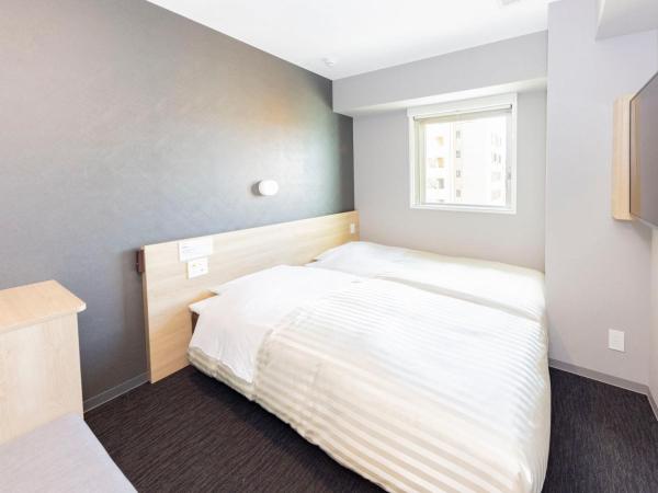 Super Hotel Sapporo Kitagojo Dori : photo 1 de la chambre chambre lits jumeaux