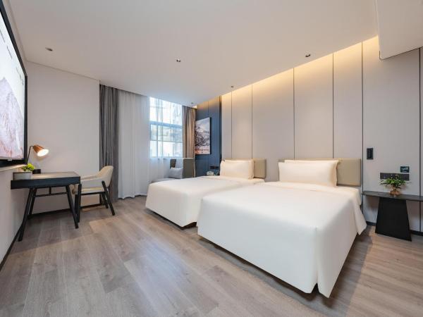 广州琶洲会展中心亚朵酒店-广交会期间免费穿梭巴士 : photo 2 de la chambre jimu twin room