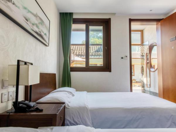 Guipu Beihai Courtyard Hotel : photo 4 de la chambre chambre familiale deluxe