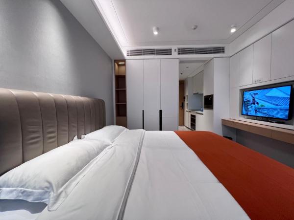 Kaisen Xiyue Hotel Apartment - Shenzhen International Convention and Exhibition Center : photo 4 de la chambre chambre lit queen-size deluxe