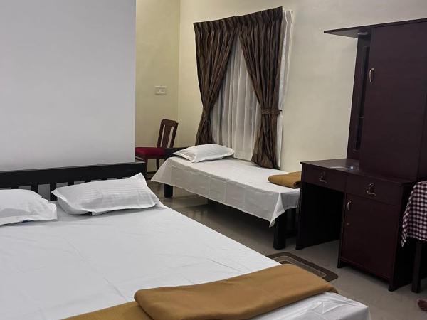 Eden Garden Farm Stay : photo 2 de la chambre chambre triple - vue sur jardin