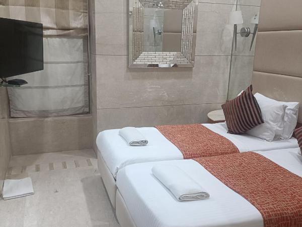 Regent Hotel : photo 3 de la chambre chambre lits jumeaux deluxe