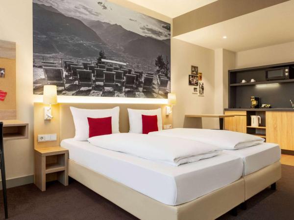 Vienna House Easy by Wyndham München : photo 2 de la chambre appartement