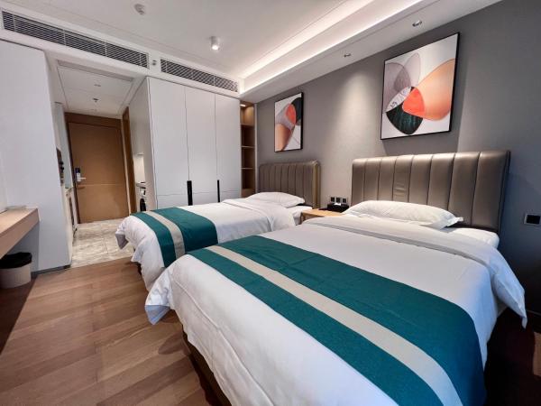 Kaisen Xiyue Hotel Apartment - Shenzhen International Convention and Exhibition Center : photo 7 de la chambre chambre lits jumeaux deluxe