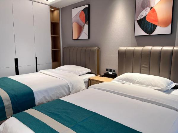 Kaisen Xiyue Hotel Apartment - Shenzhen International Convention and Exhibition Center : photo 1 de la chambre chambre lits jumeaux deluxe